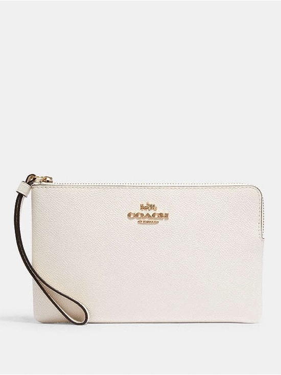 Coach Handbags - Coach Cream Leather Wristlet with Gold Logo